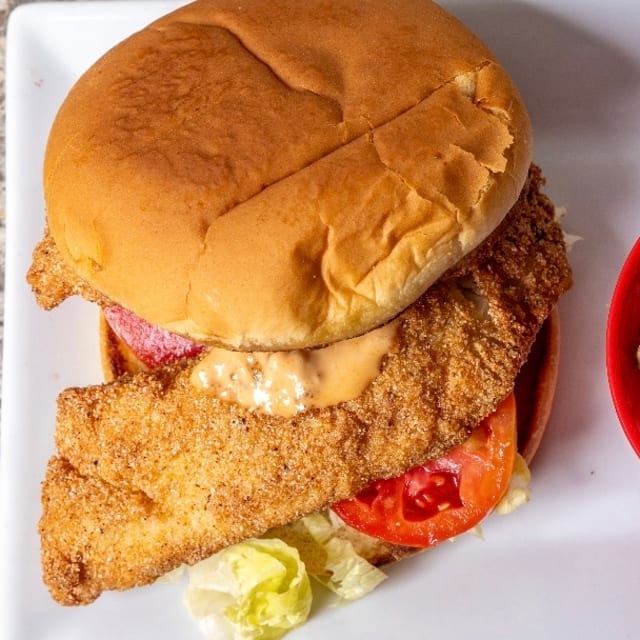 Cajun fish sand with fries.